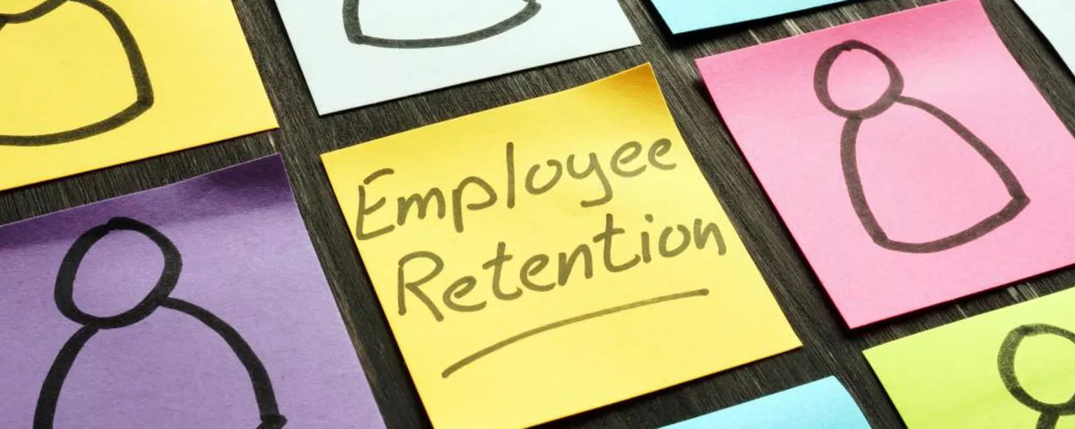 14 Effective Employee Retention Strategies — coloured sticky notes with the words "employee retention" on one in the middle