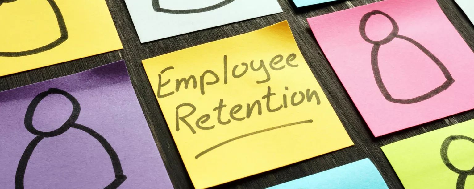 A boxed pattern of colored sticky notes has the words "employee retention" on the one in the middle.