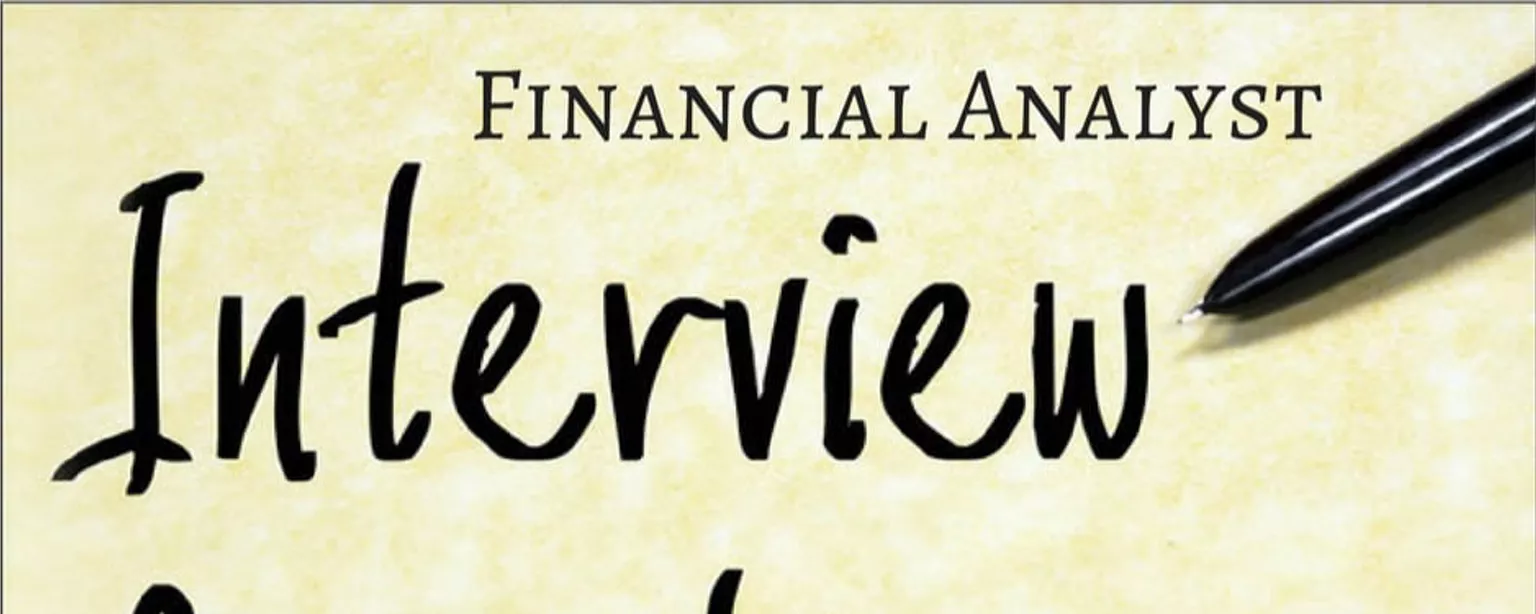 The words, Financial Analyst Interview Questions, and a pen