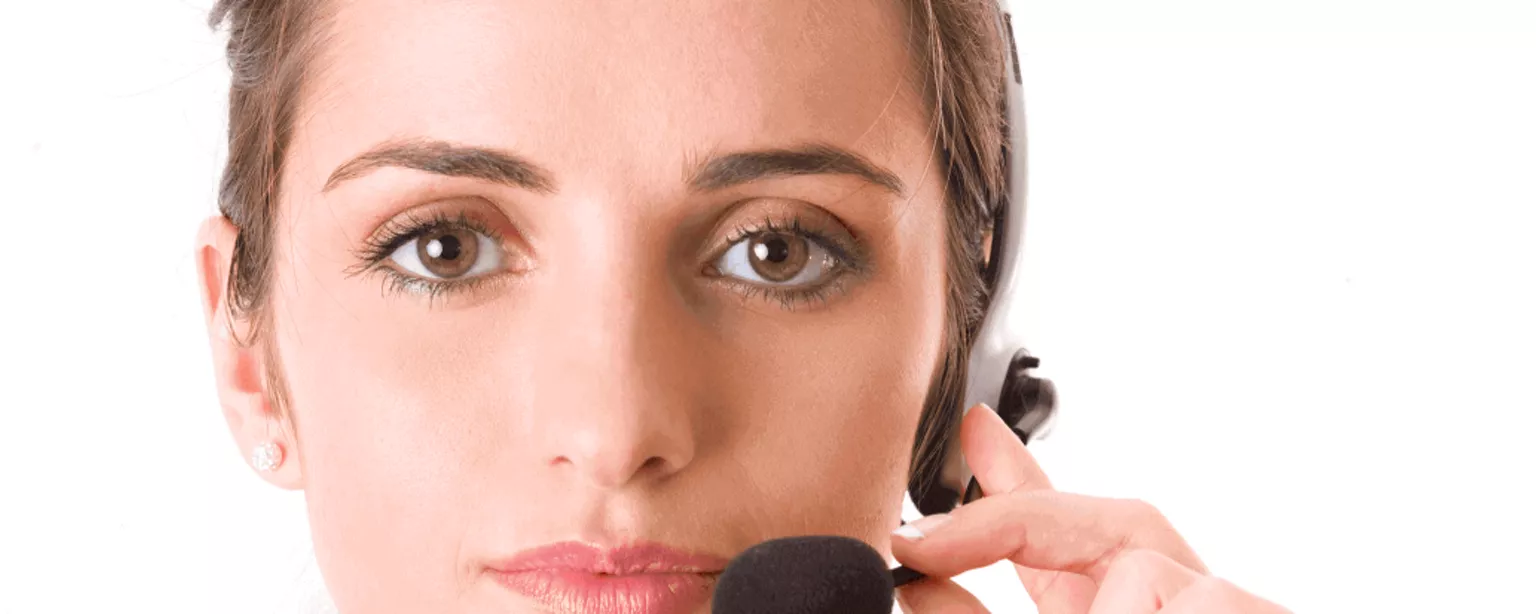 Ready to Hire a Receptionist? 6 Qualities of a Good Receptionist — closeup of woman in red with headphone and microphone