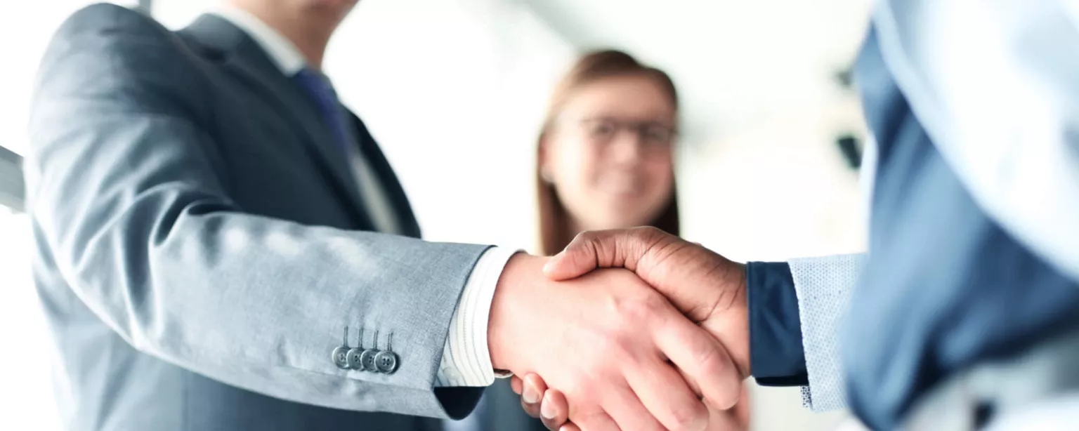 Handshakes representing successful hiring trends in the workplace