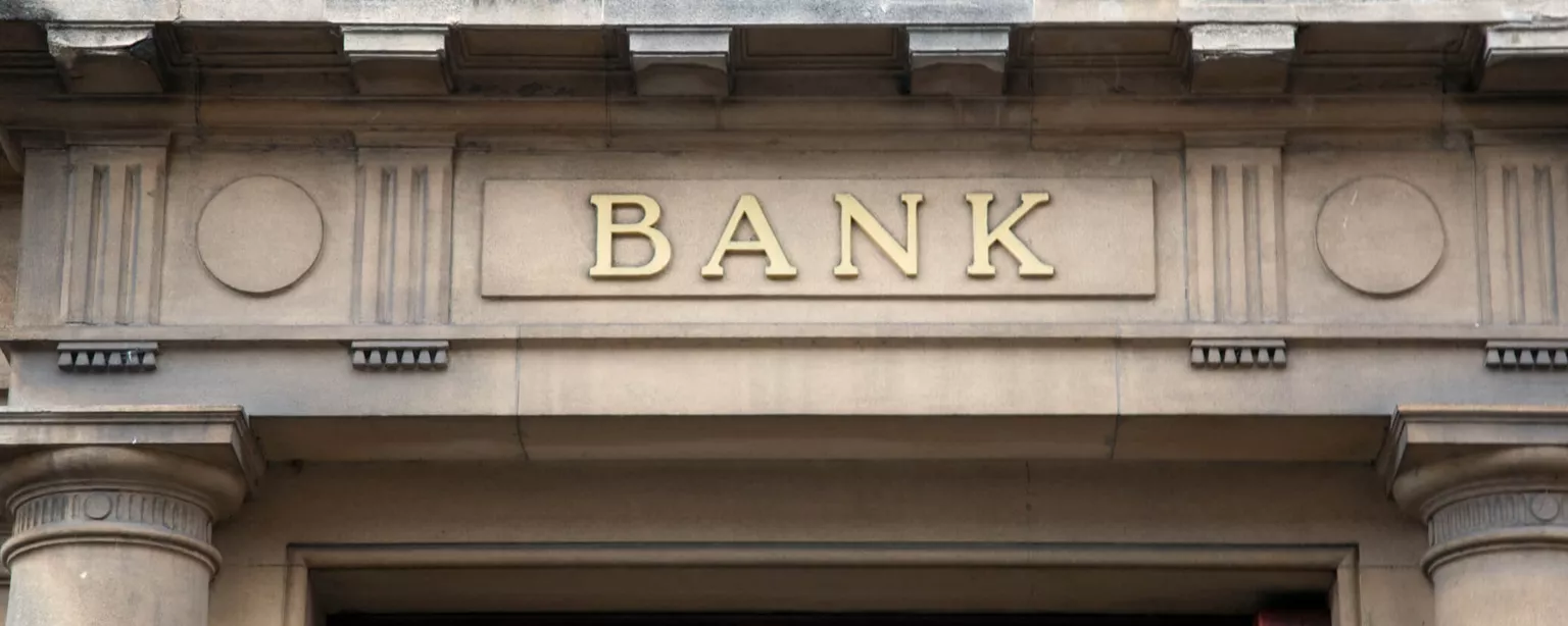 How Do Investment Banking Salaries Stack Up? — front of building with word BANK