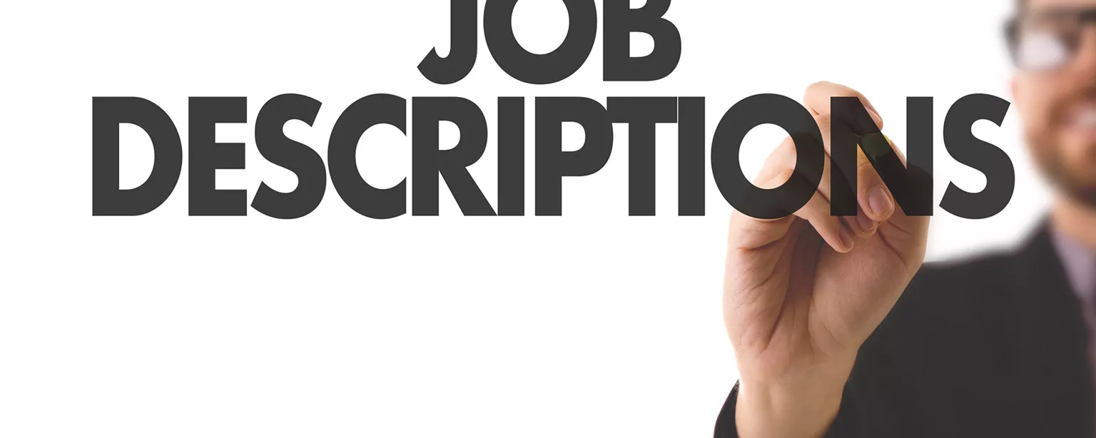 Man writing the word job descriptions
