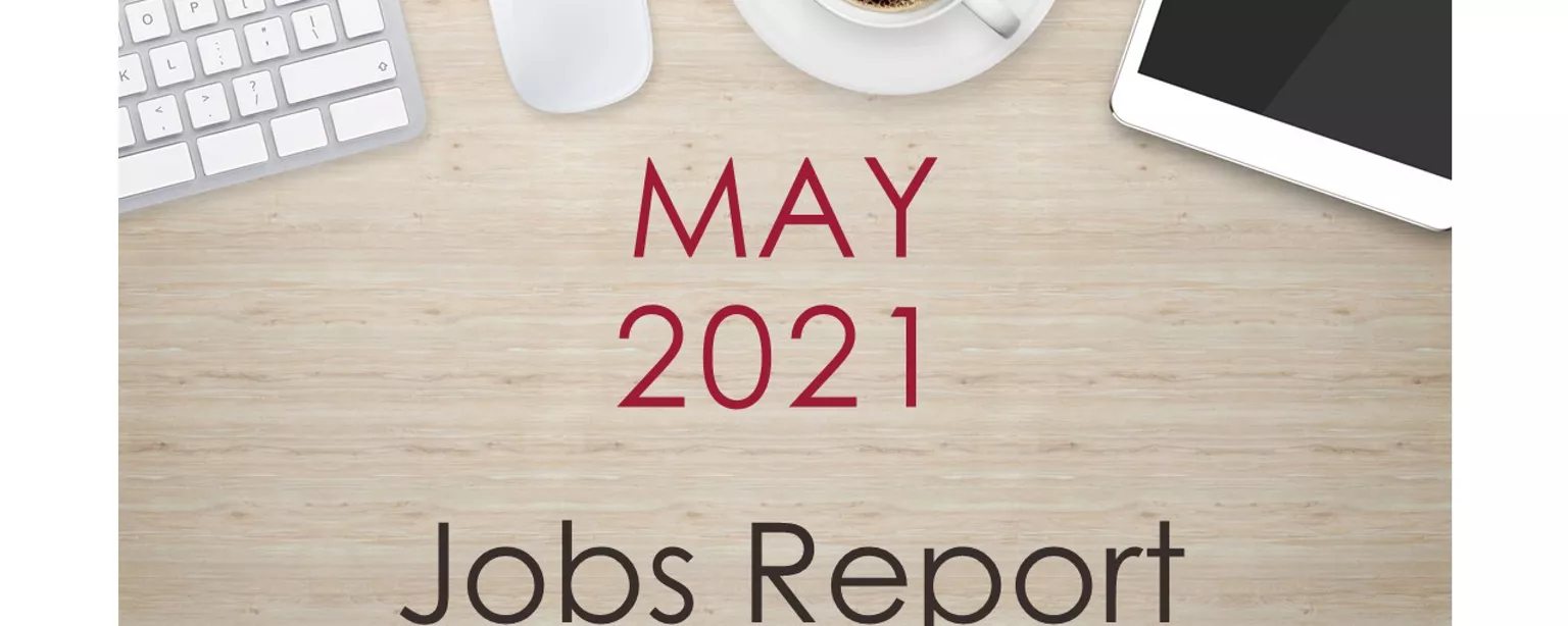 Image of a desk with text that reads, "May 2021 Jobs Report"