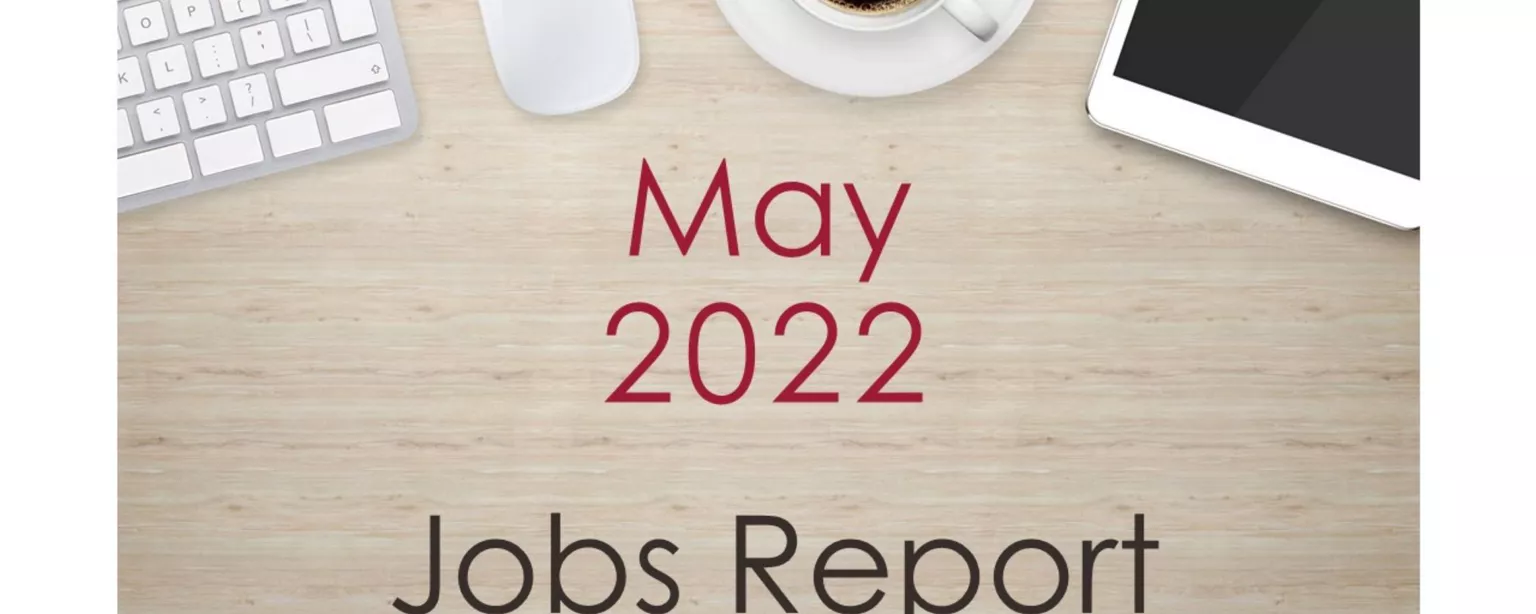Desktop with keyboard, tablet and coffee cup, with text that reads: May 2022 Jobs Report.