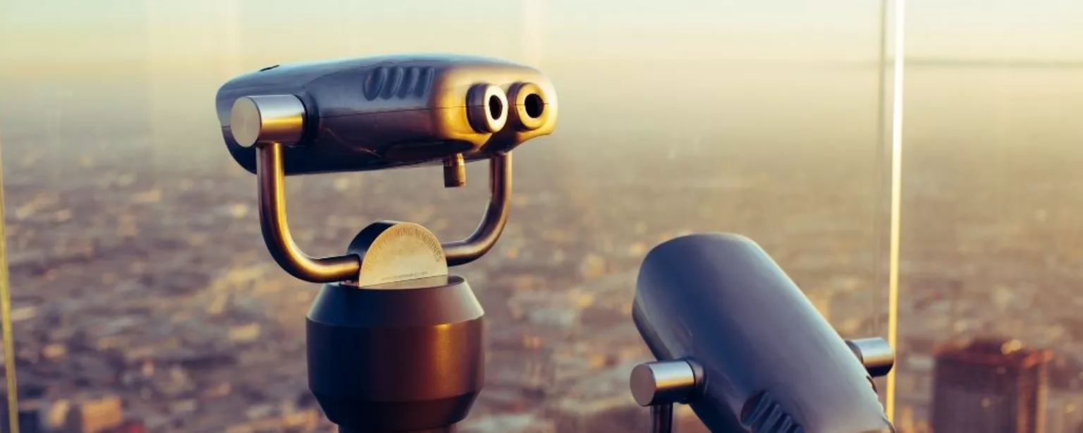 Binoculars on the top of a tall building 