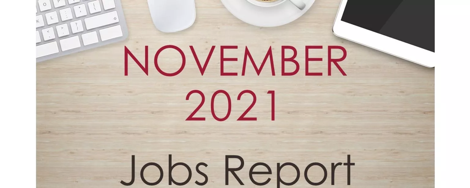 Desktop with keyboard, tablet and coffee cup, with text that reads: November 2021 Jobs Report
