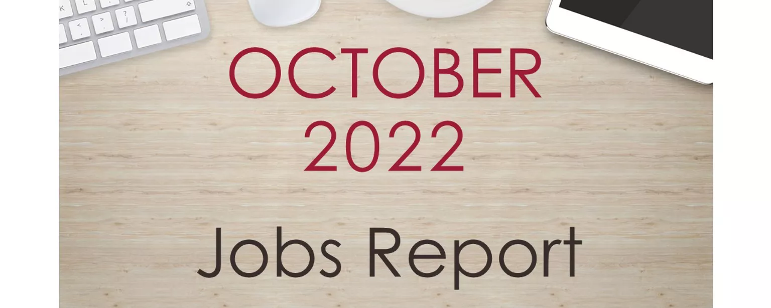 Desktop with keyboard, tablet and coffee cup, with text that reads: October 2022 Jobs Report.