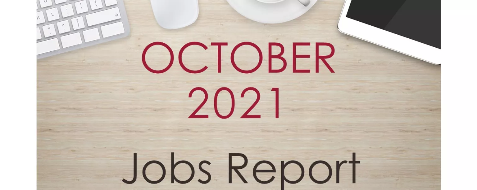 Desktop with keyboard, tablet and coffee, with text that reads: October 2021 Jobs Report