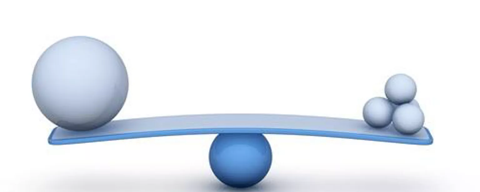 Balancing balls to show comparison of large or small companies