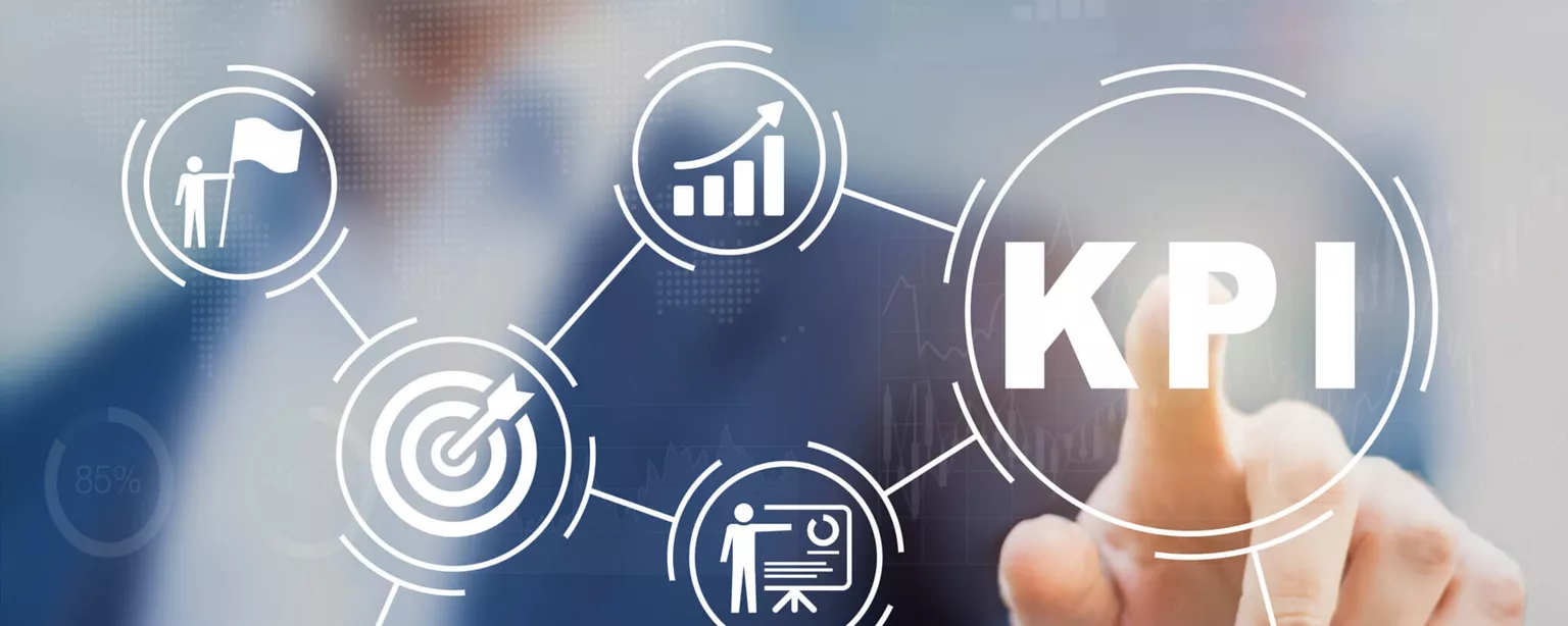 Why Recruiting Metrics and KPIs Matter More Than Ever — man standing behind glass and pointing at letters KPI