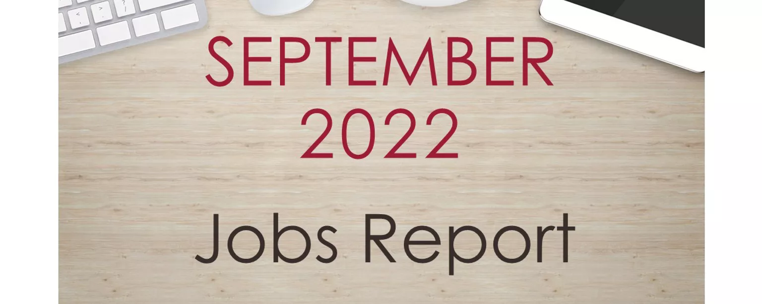 Desktop with keyboard, tablet and coffee cup, with text that reads: September 2022 Jobs Report.