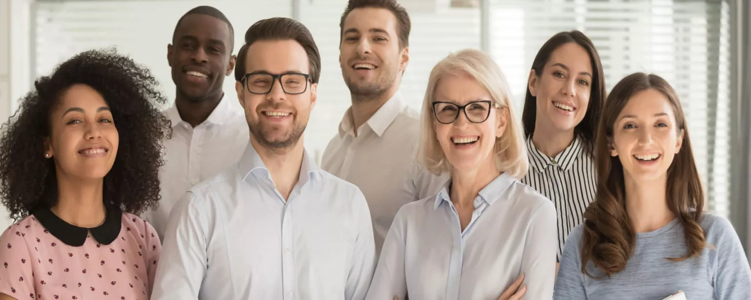 Group of smiling business people of all ages, genders and ethnic backgrounds