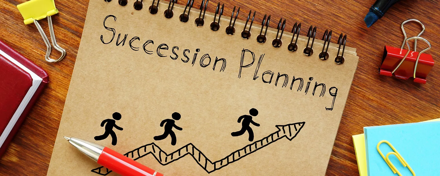 Succession Planning is shown on a business photo using the text.