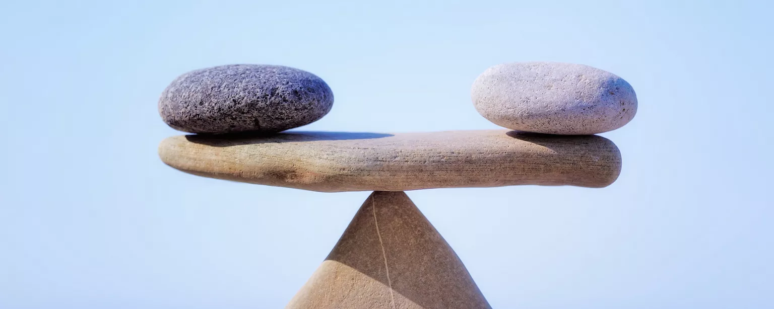 Balancing rocks to illustrate the concept of work-life balance.