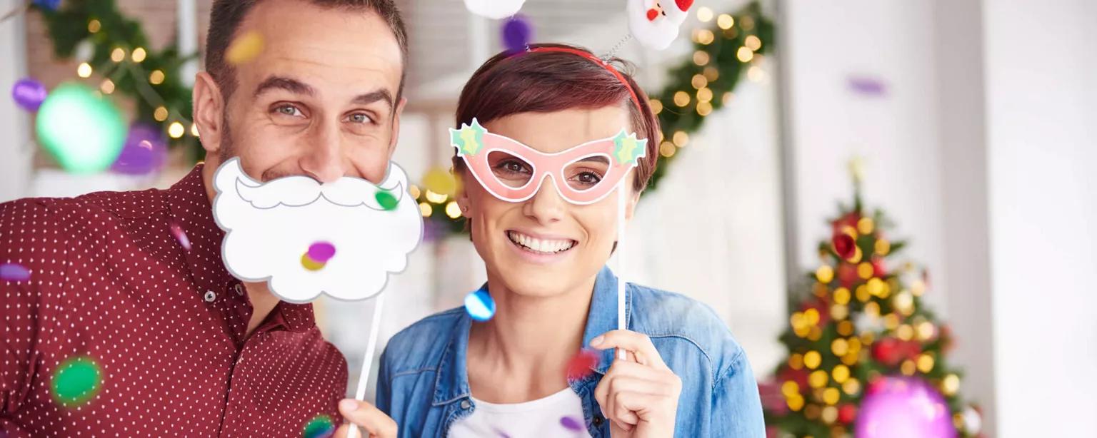 Two colleagues enjoying the silly season in the office