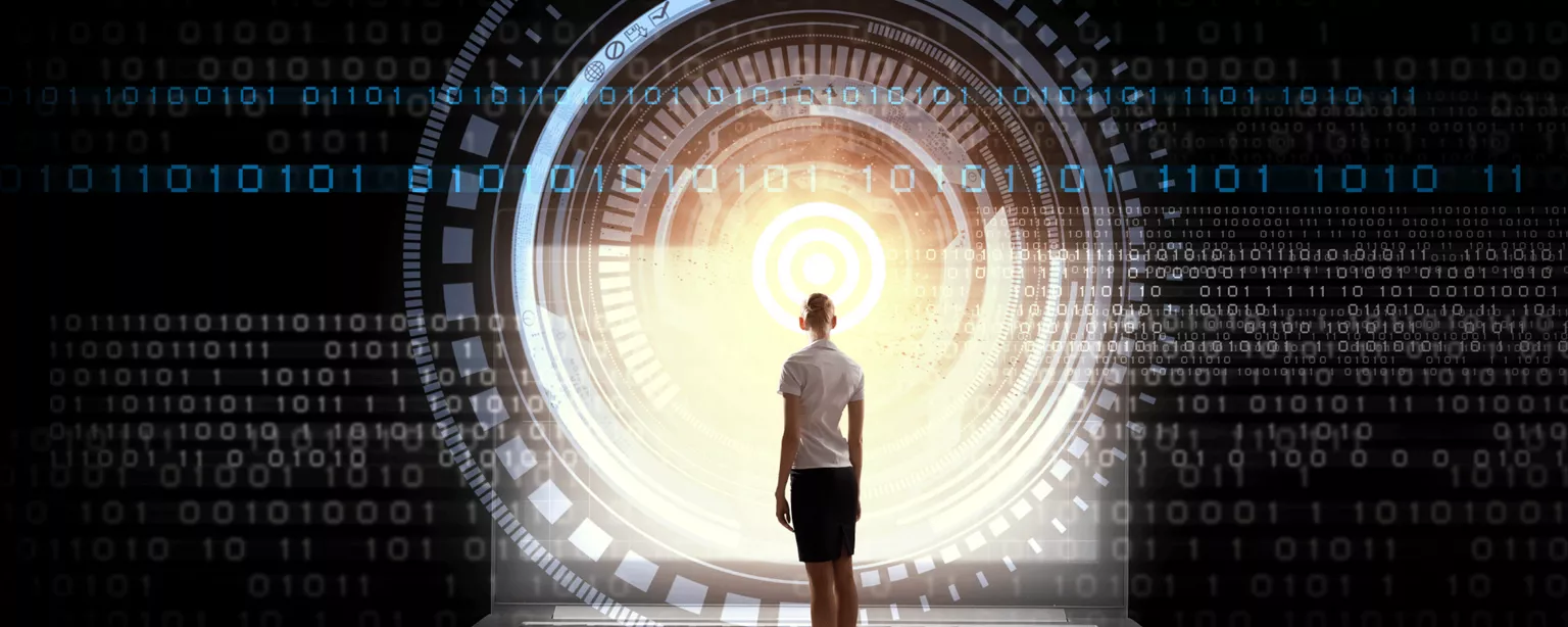 A businesswoman looking toward a tunnel of light representing the future.
