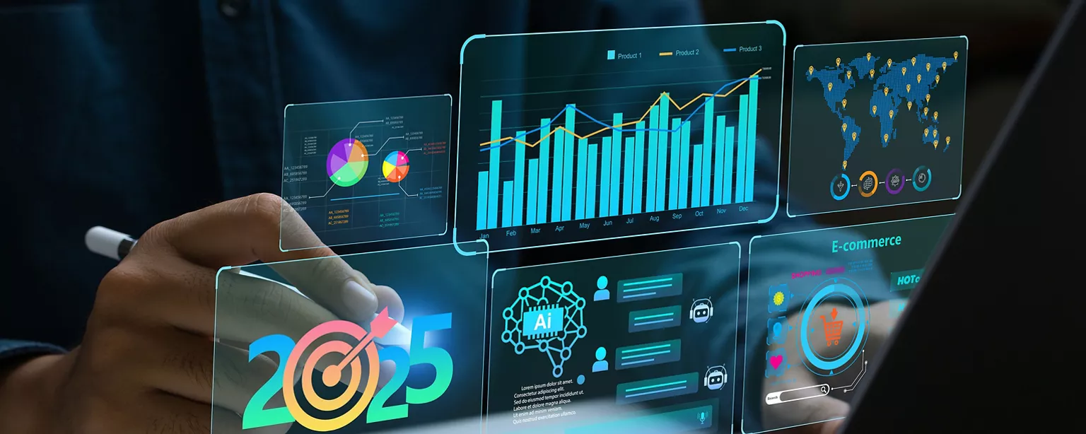 Businessperson works on a laptop showing 2025 business trends dashboard with charts