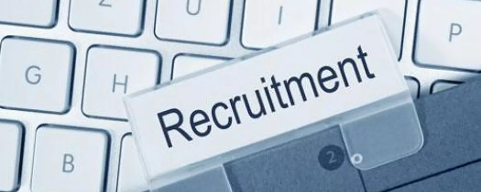 The word "recruitment" is visible above a keyboard