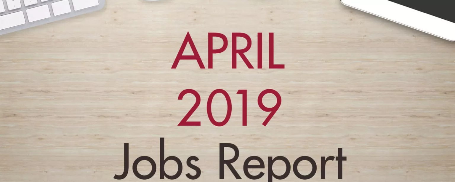 An image of a desk with text that reads, "April 2019 Jobs Report"