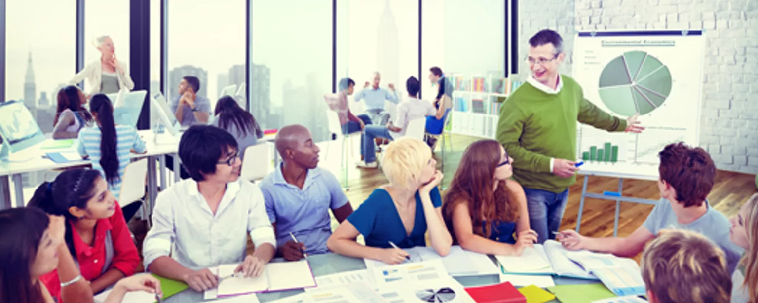 Large table of people getting professional training