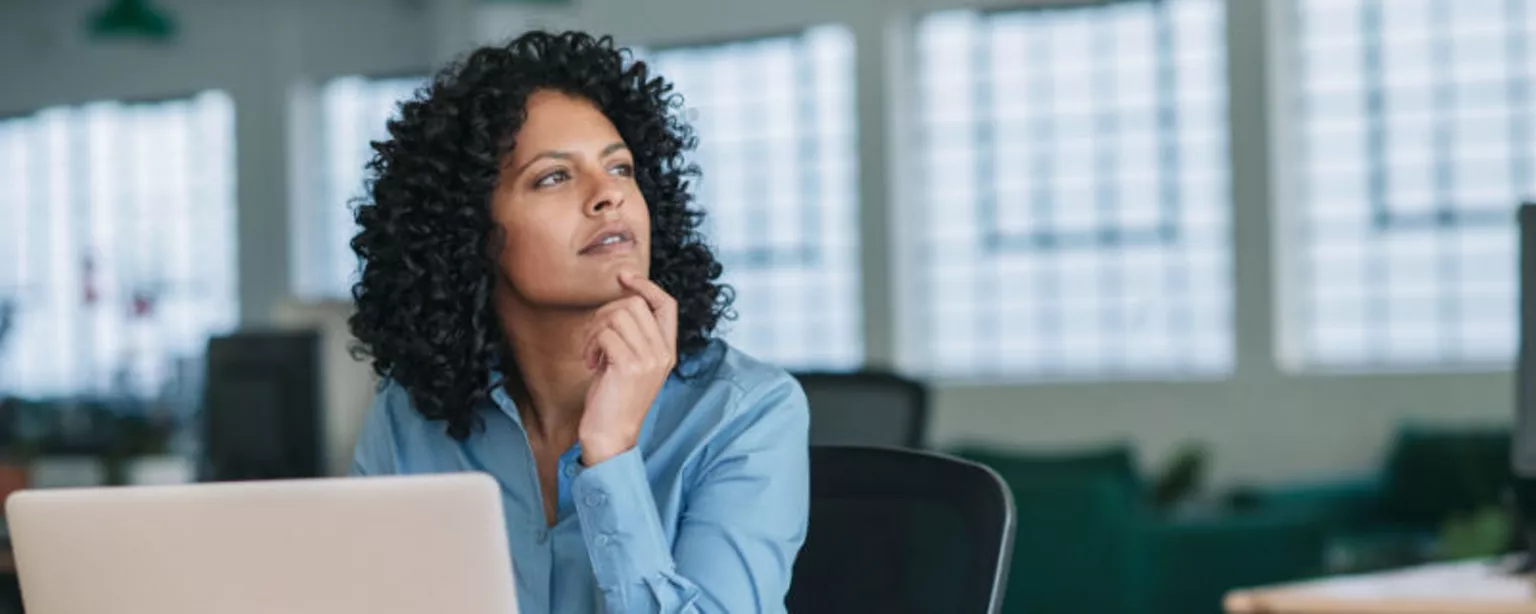 A woman in an office environment gives some thought to how she can stay prepared for the unexpected when it comes to her career.