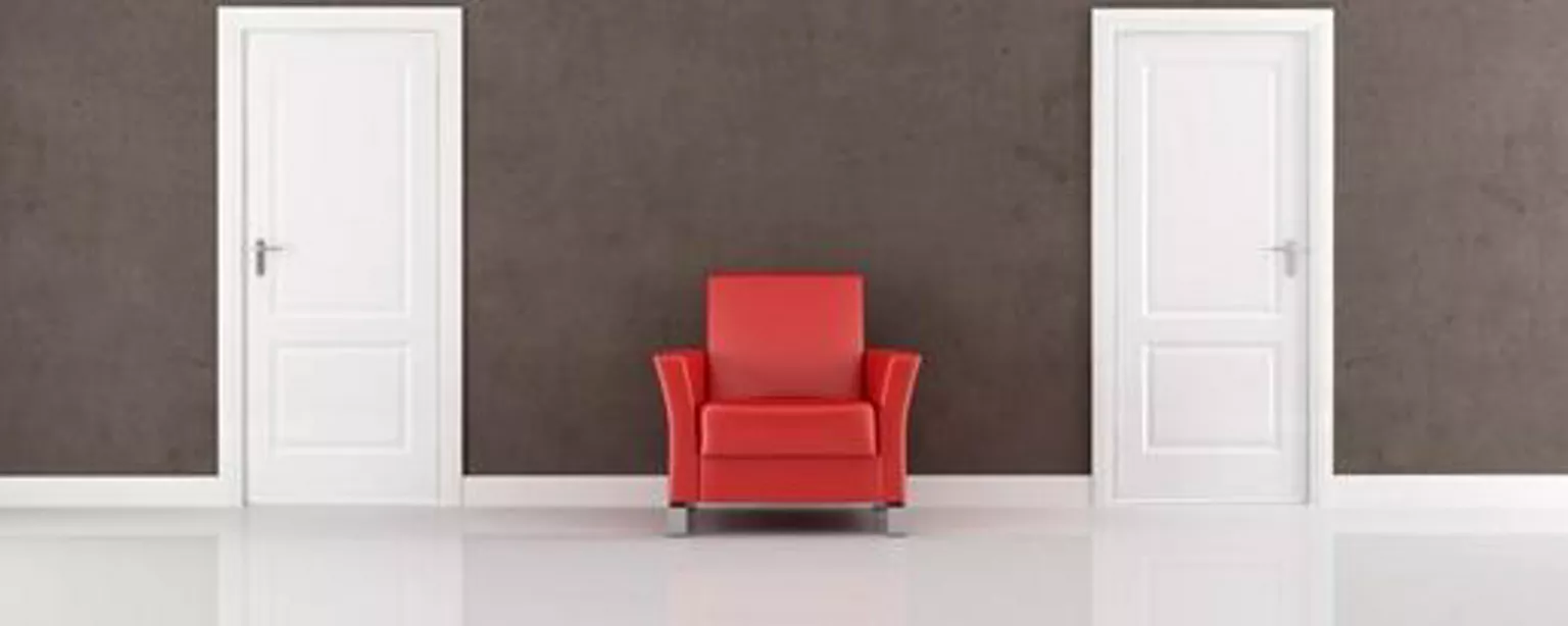 A red chair between two doors that someone with a counteroffer could choose to open