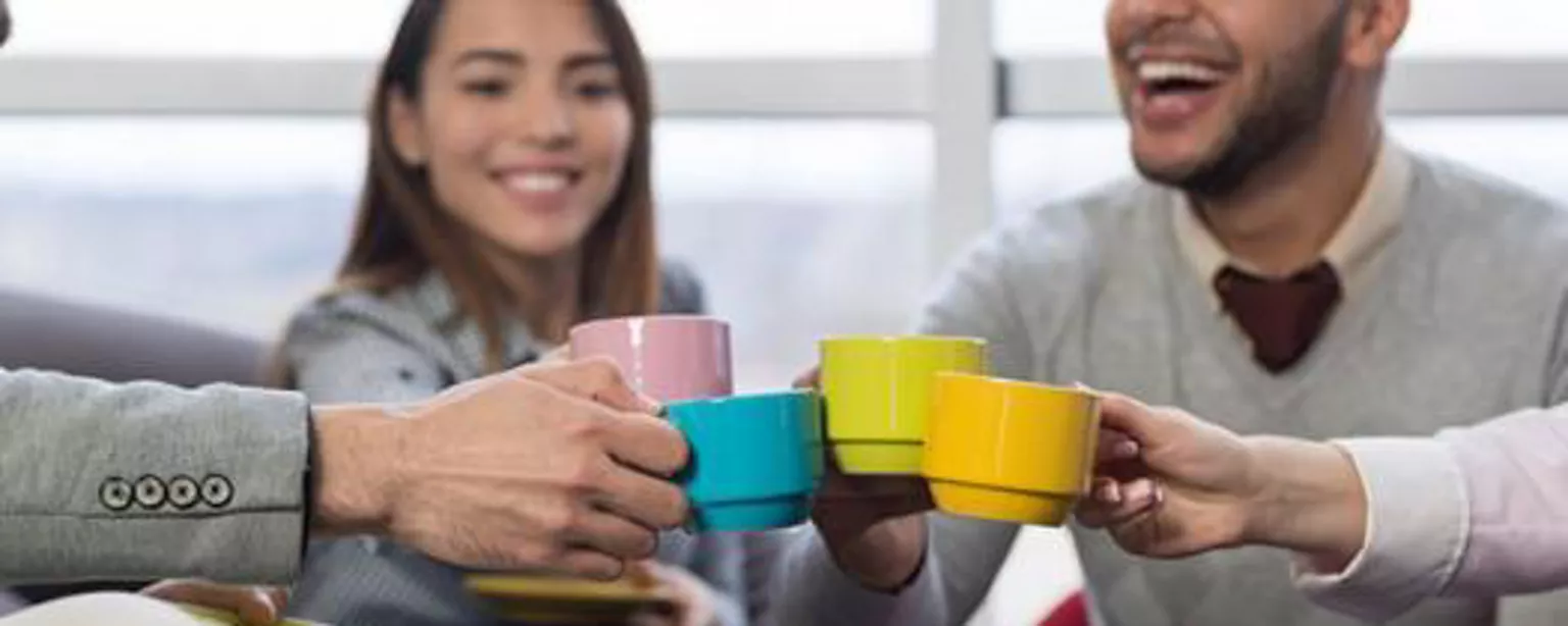 Creatives drinking coffee in a creative work environment