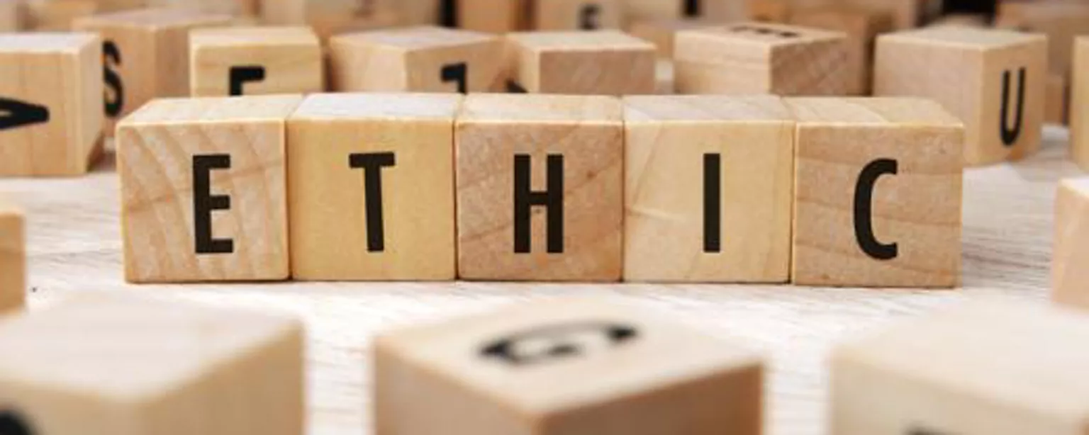Scrabble tiles spell "ETHIC"