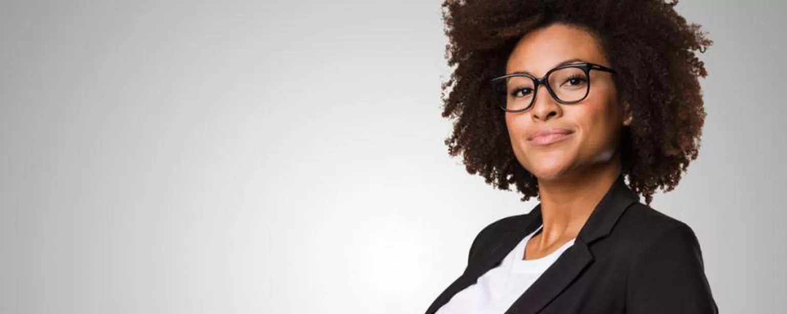 powerful black woman dressed in a suite