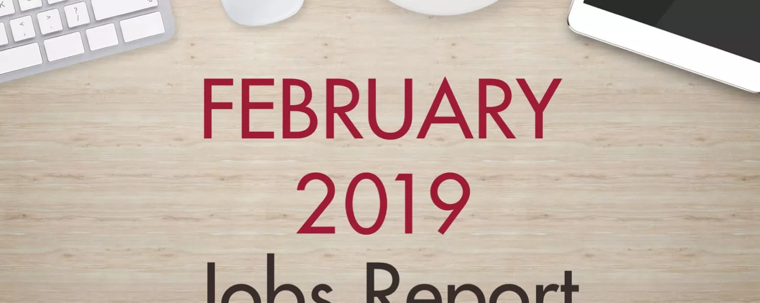 An image of a desk with text that reads, "February 2019 Jobs Report"