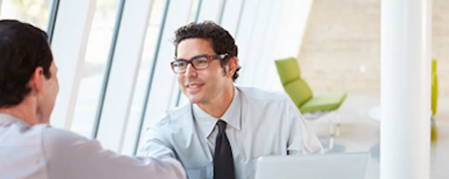 Job recruiter greets candidate