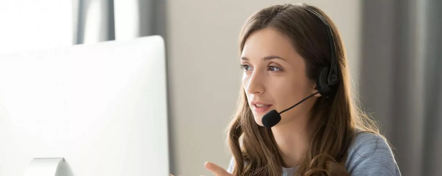 A female manager listens sympathetically as an employee informs her she will be leaving her job.