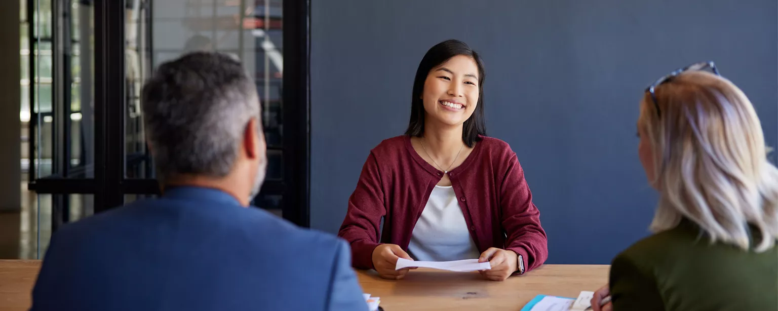 a person interviewing for an accounts payable job with two other interviewers