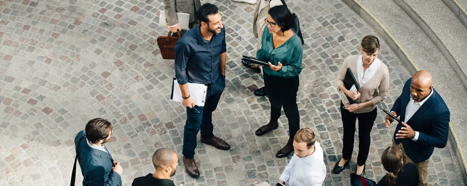 workers gathering outside of office building