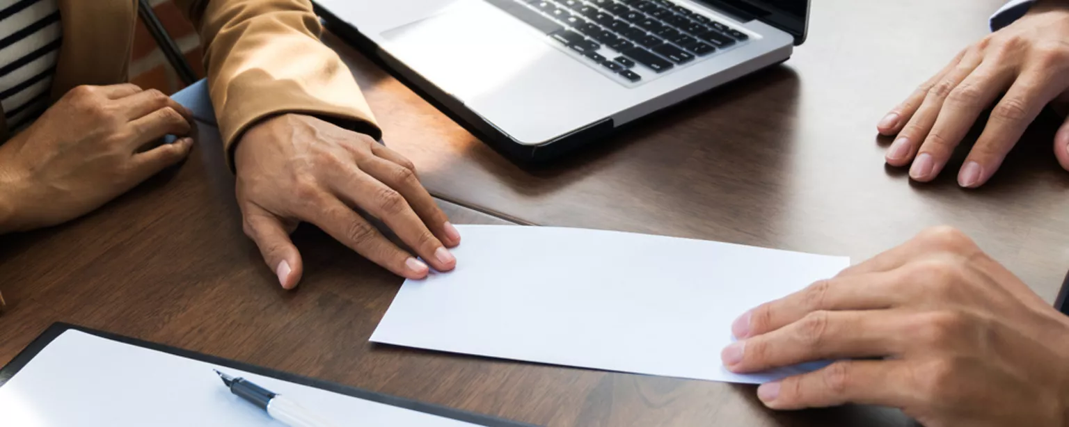 employee handing in their resignation letter