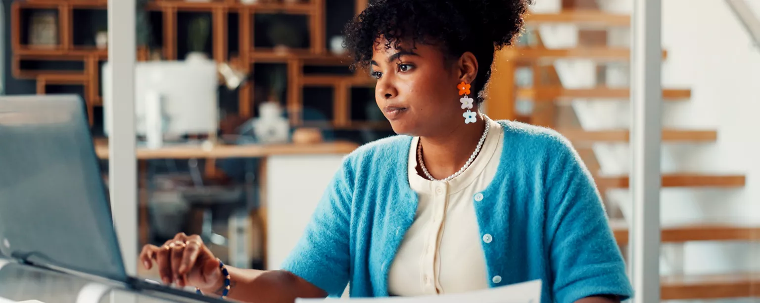 woman working at her laptop in an office