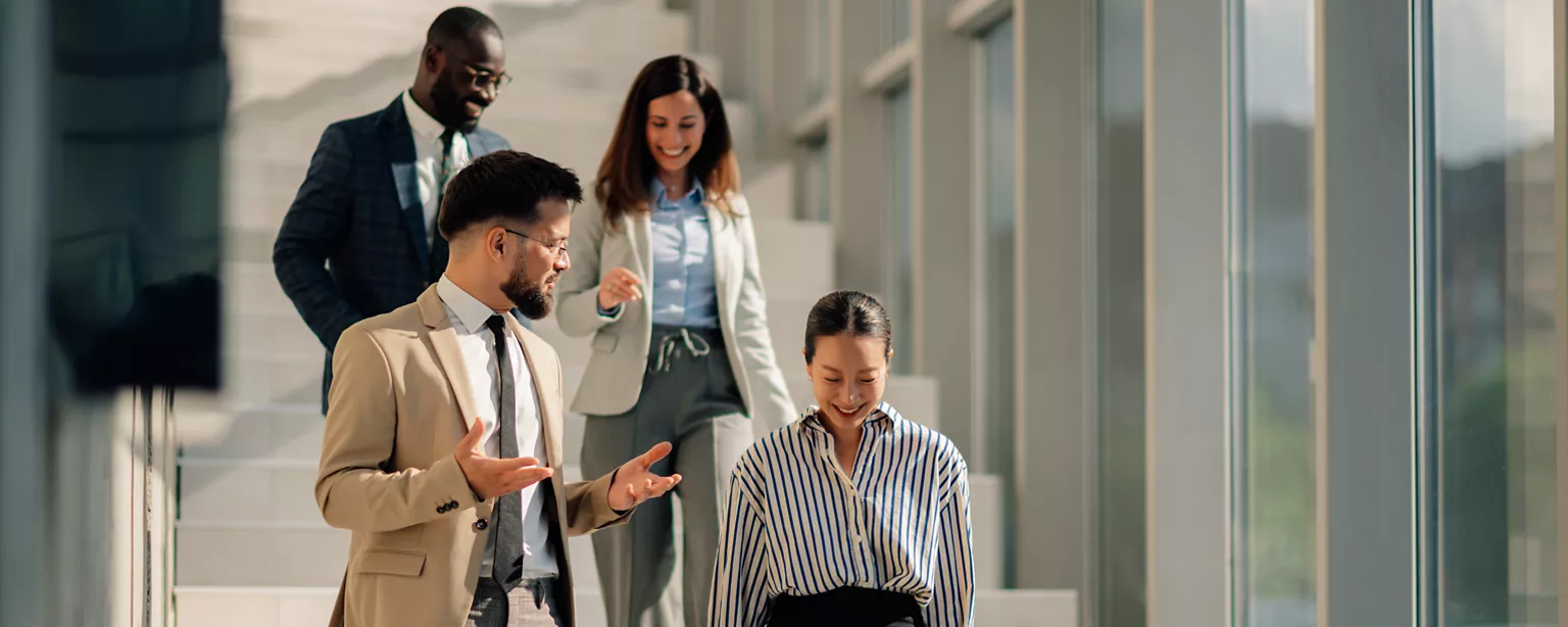 workers in an office talking