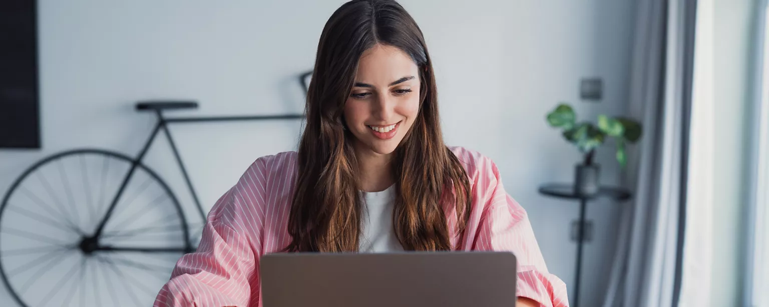 Young businesswoman writing an email for a salary raise