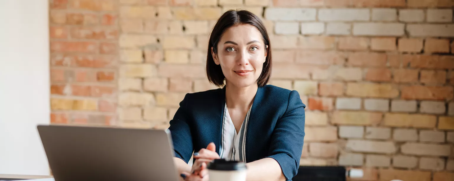 Woman looking into the camera, ready to talk about salary expectations