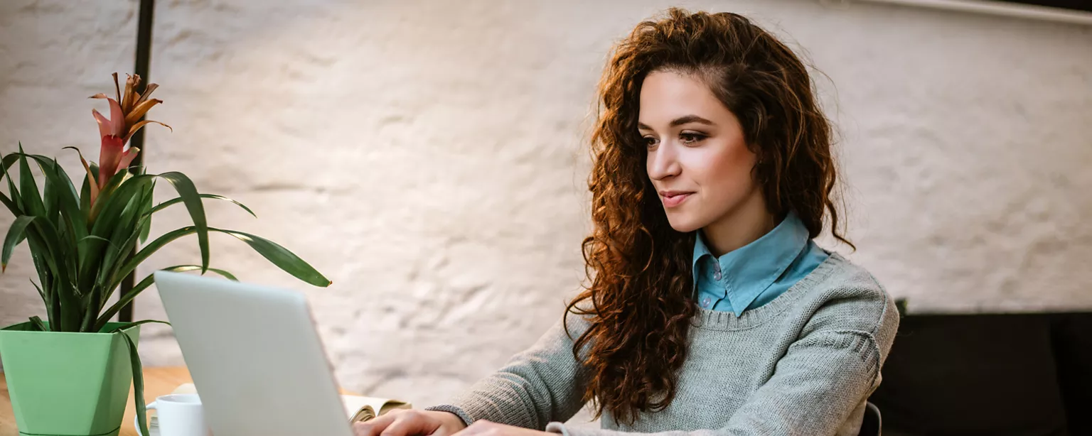 Woman writing a thank you email after a job interview