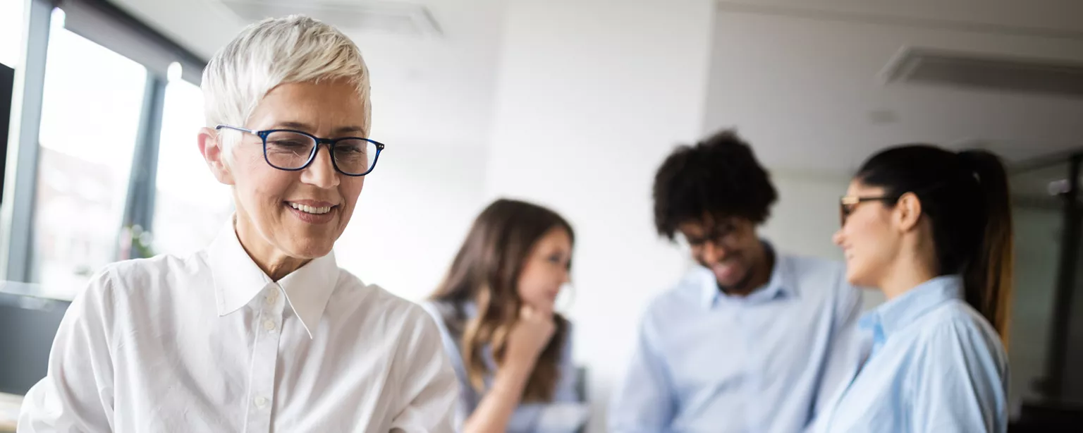 Employees in an office collaborating.