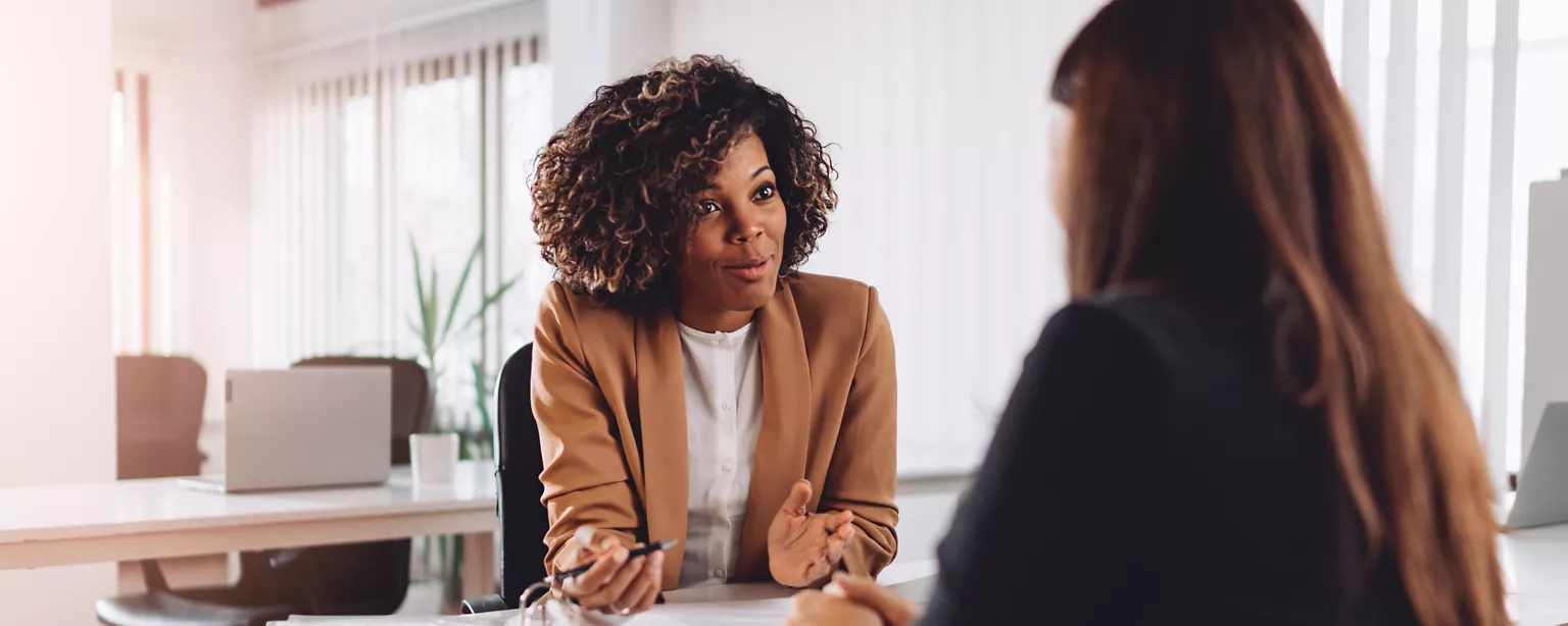 Hiring manager asking a candidate questions during an interview