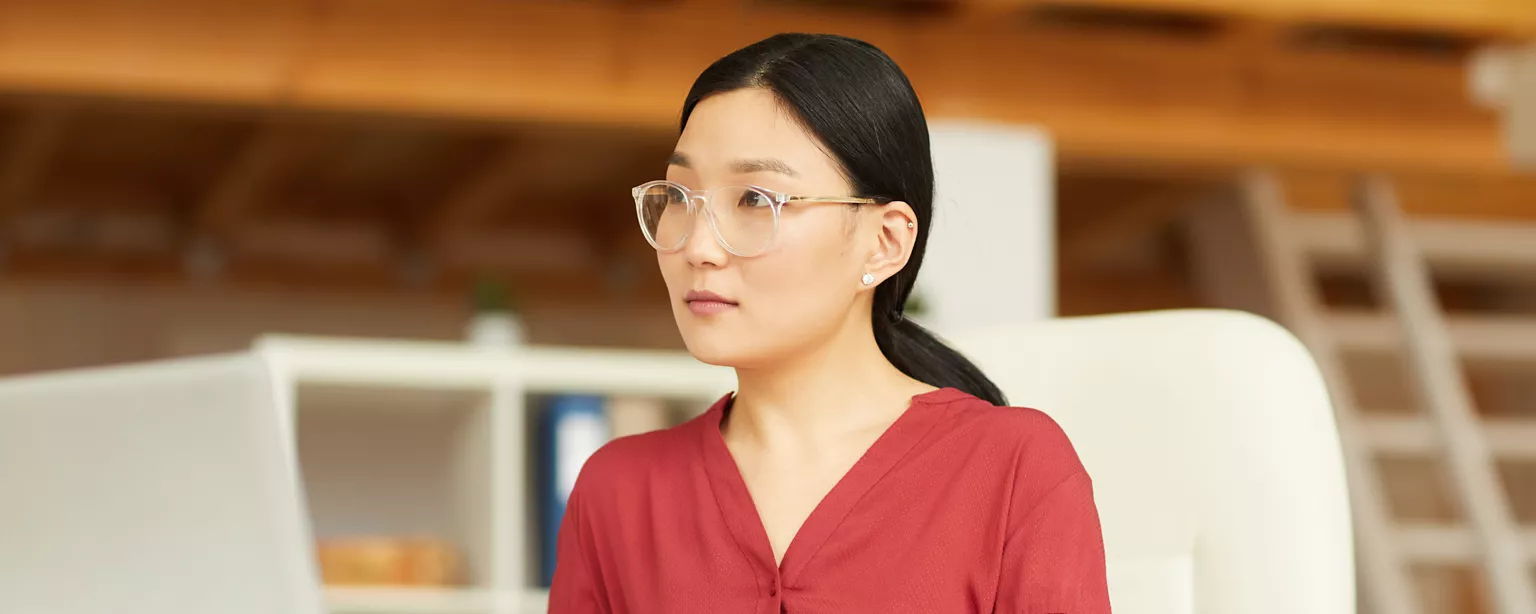 Woman sitting at her desk, considering different learning styles