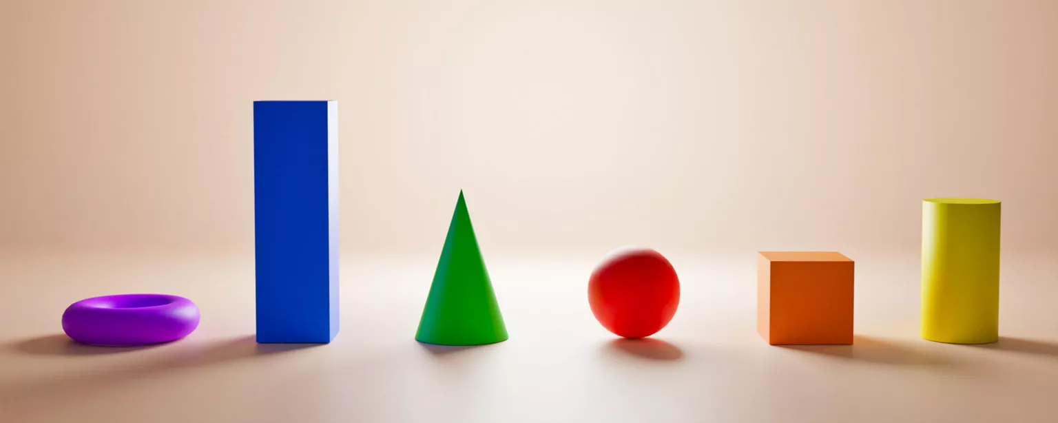 Blocks, balls and rings of different colors, sizes and shapes, standing in row against a plain background.