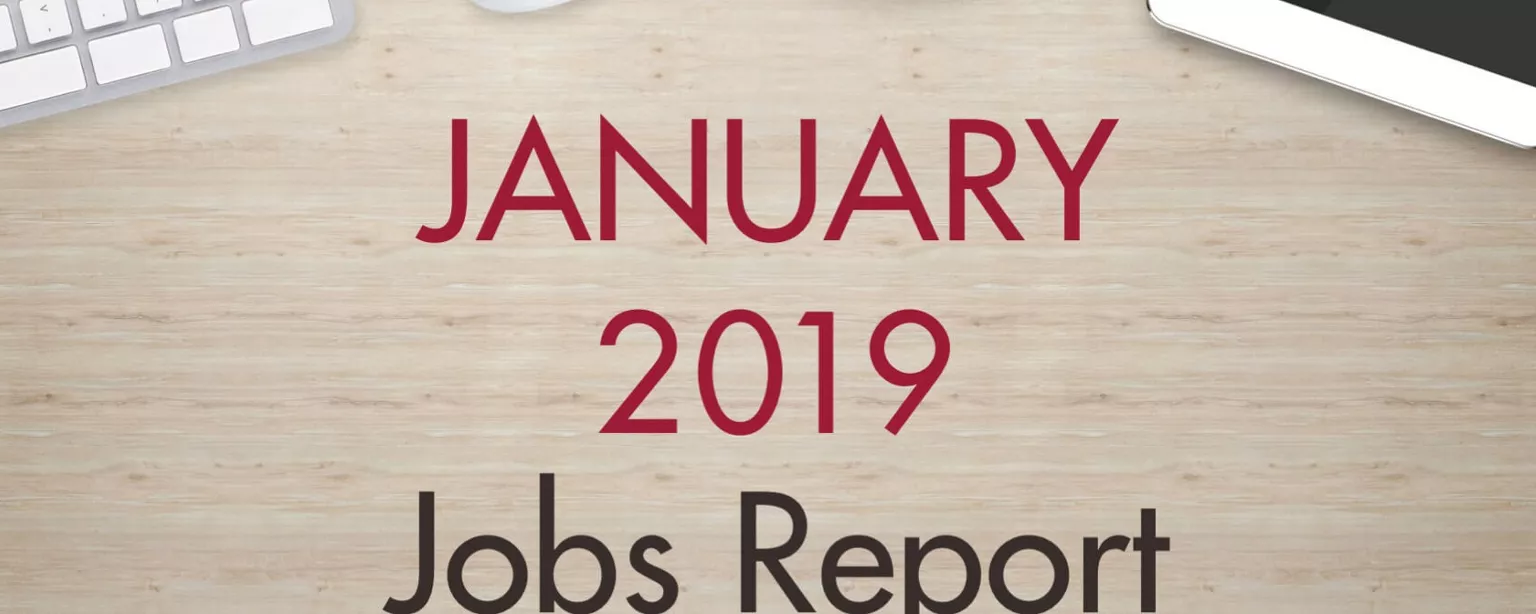 An image of a desk with text that reads, "January 2019 Jobs Report"