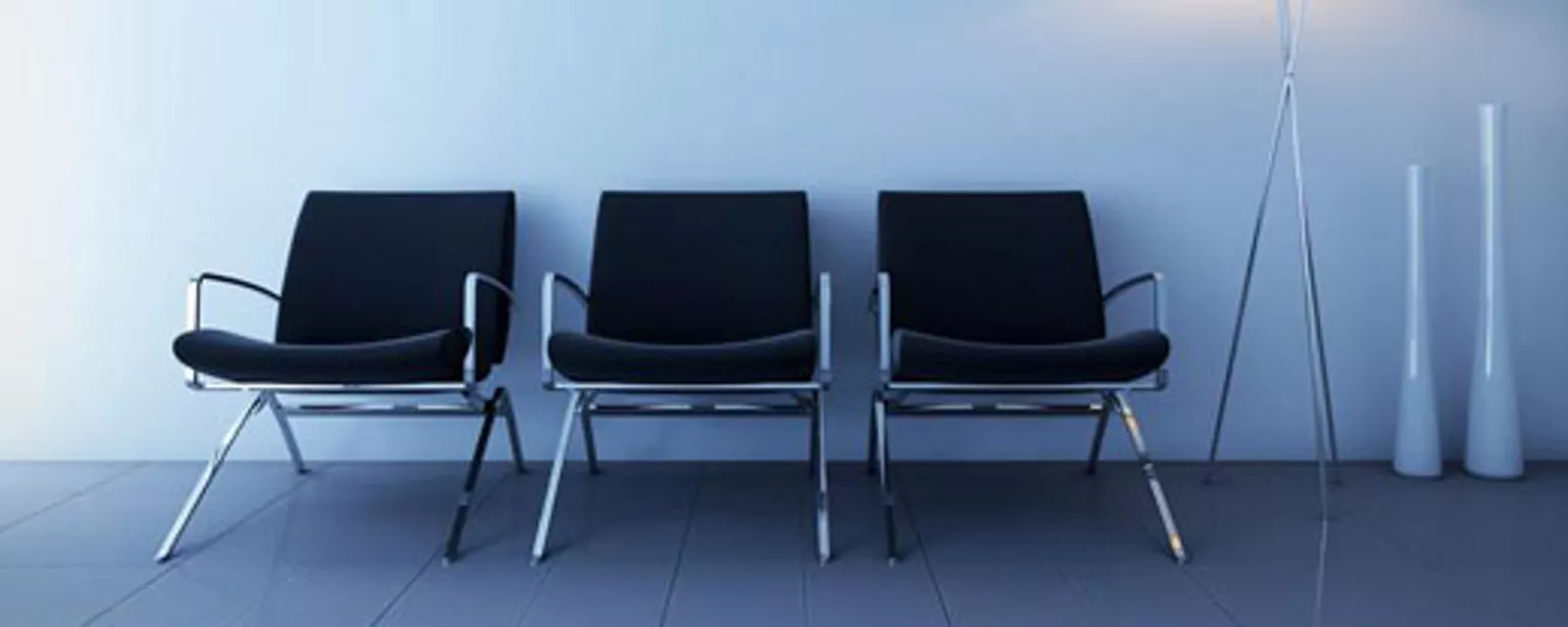 Image of empty chairs outside an office where a creative job interview is taking place.