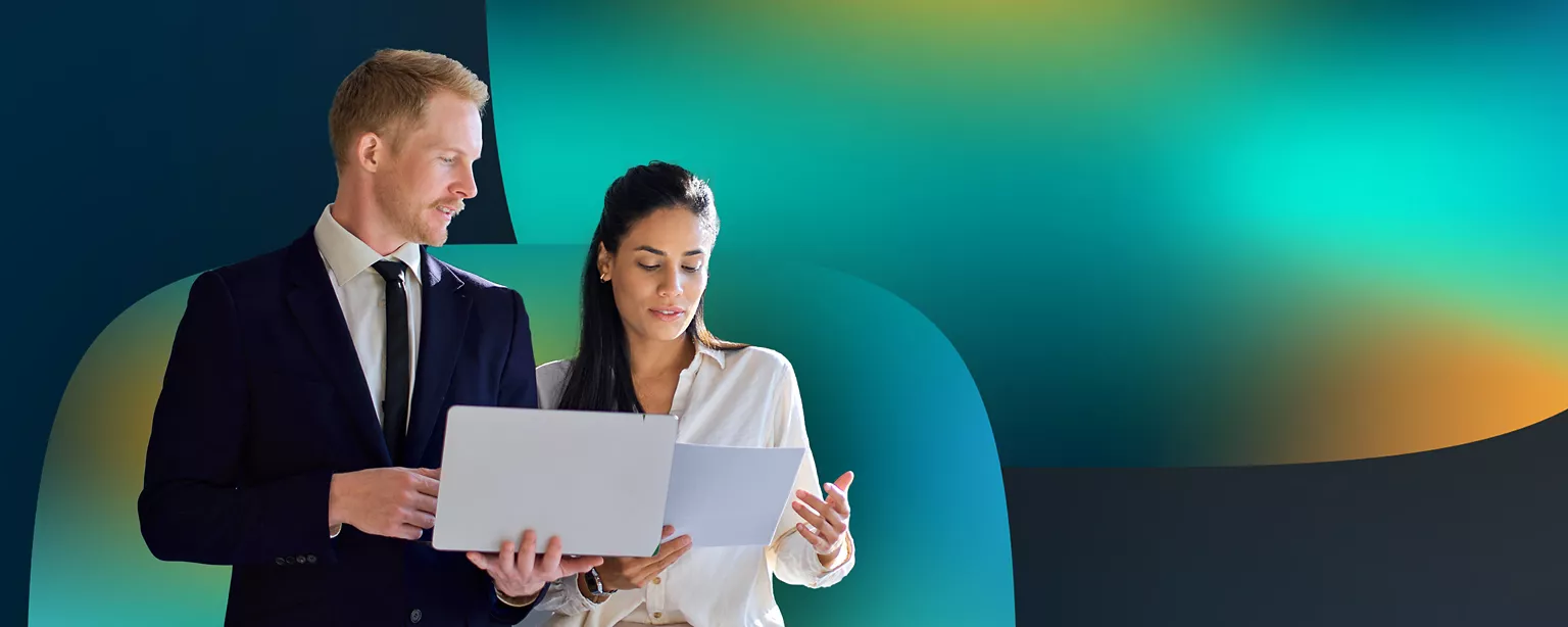Two people standing looking at legal documents.