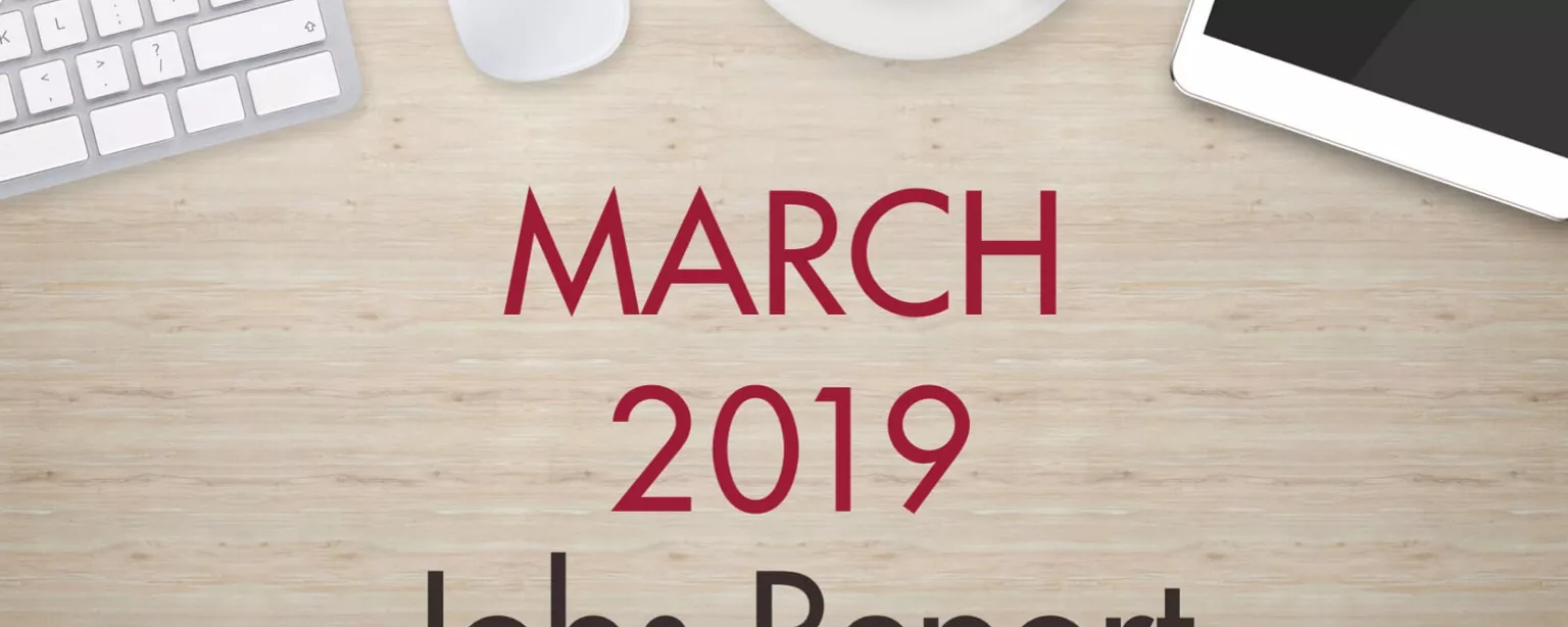 An image of a desk with text that reads, "March 2019 Jobs Report"