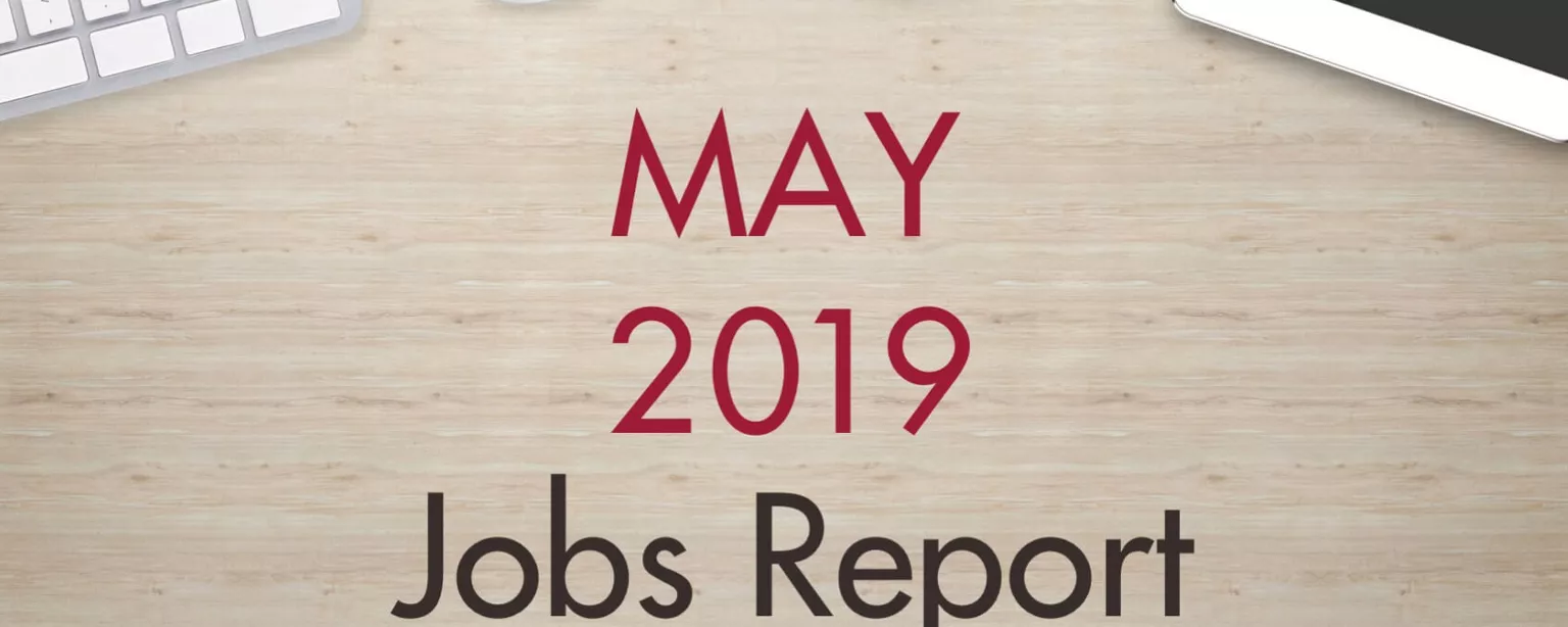 An image of a desk with text that reads, "May 2019 Jobs Report"